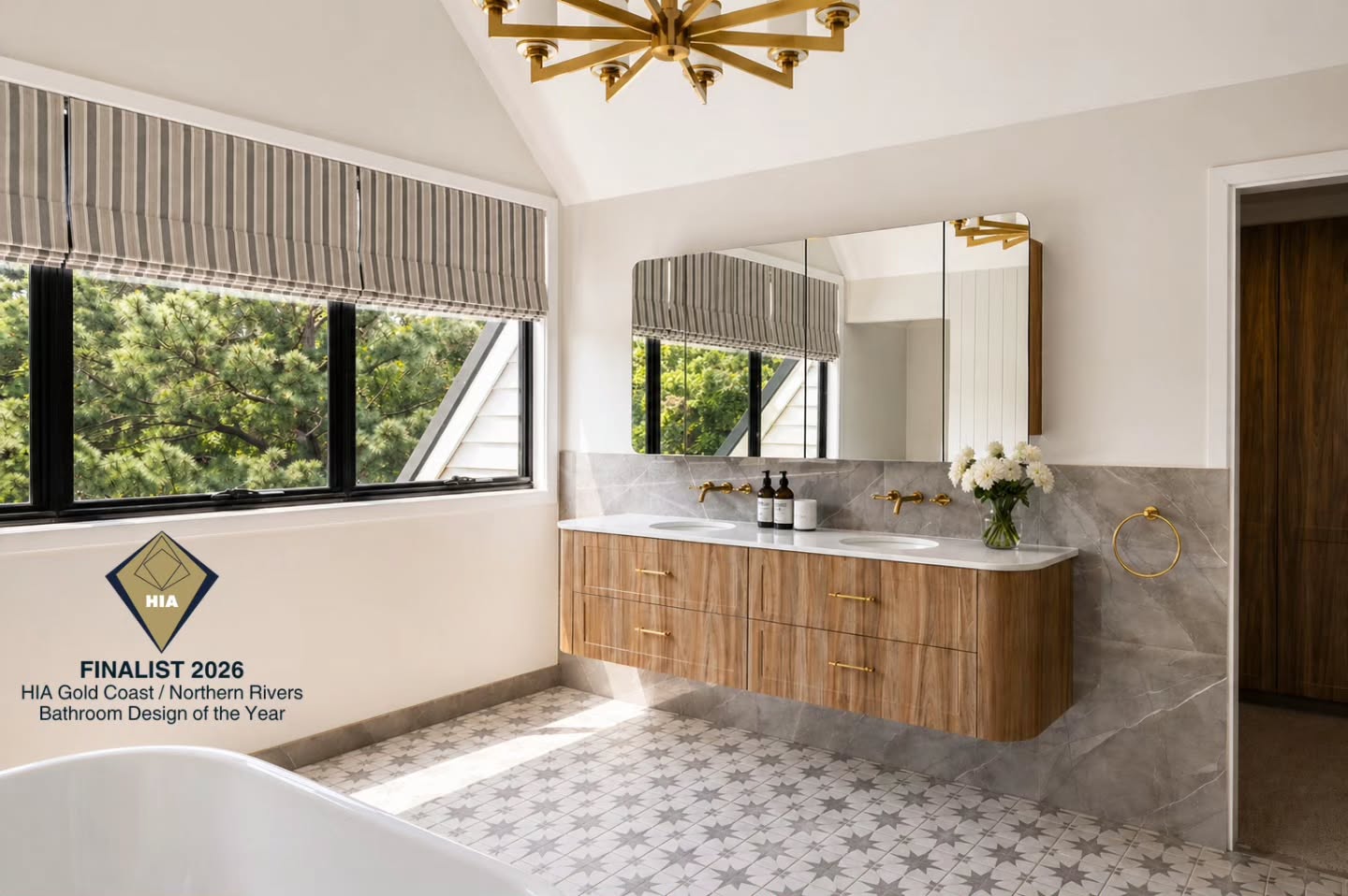 Bathroom with a curved timber vanity, brass tapware, marble splashback and patterned floor tile — HIA Gold Coast / Northern Rivers Bathroom Design of the Year Finalist 2026